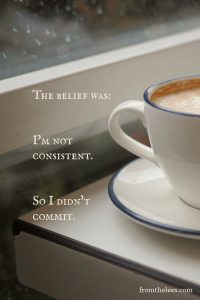 Minimal still life of a white coffee cup with a reflective quote, "The belief was: I'm not consistent. So I didn't commit."